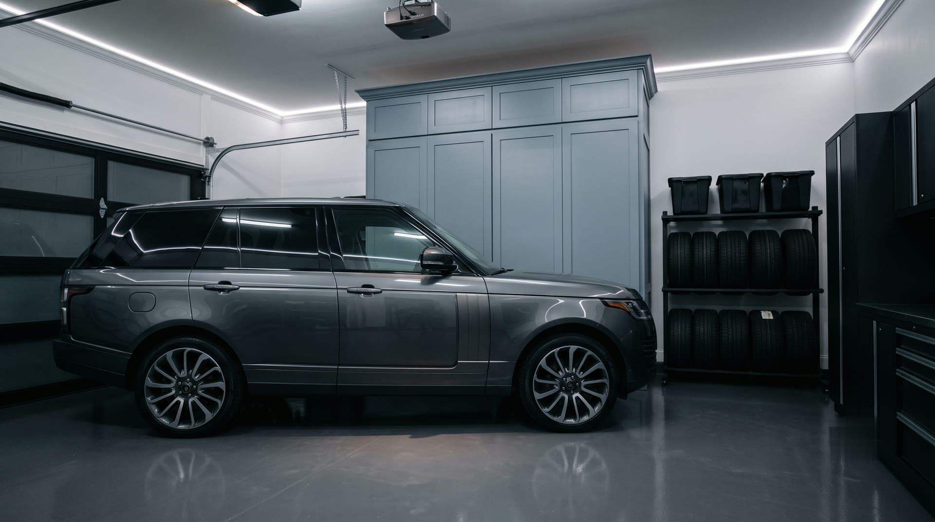 Murphy golf simulator cabinet fully closed in a garage, with a luxury SUV parked beside it